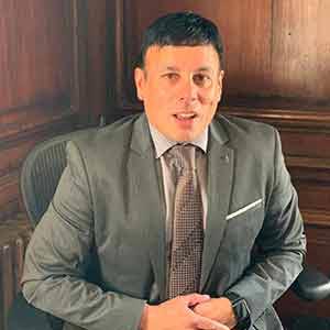 Mr. Rue Dilhe, Managing Director, Exel Computer Systems PLC